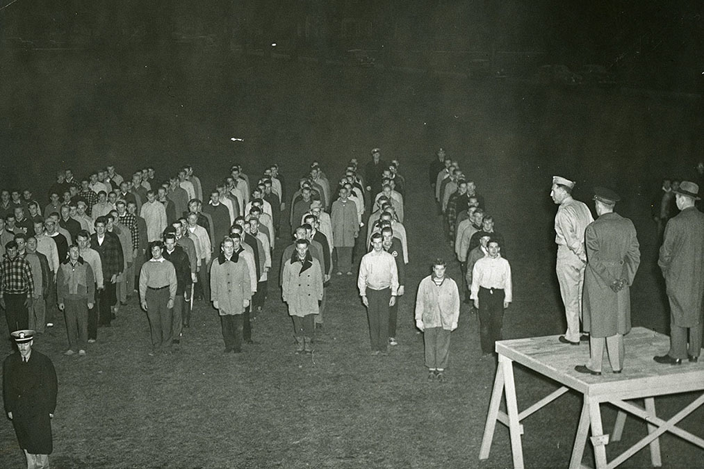 Student Corps dressed warmly for early morning drills on Whitnall Field, 1942