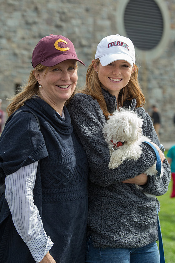 Student and mother with dog in Colgate hats