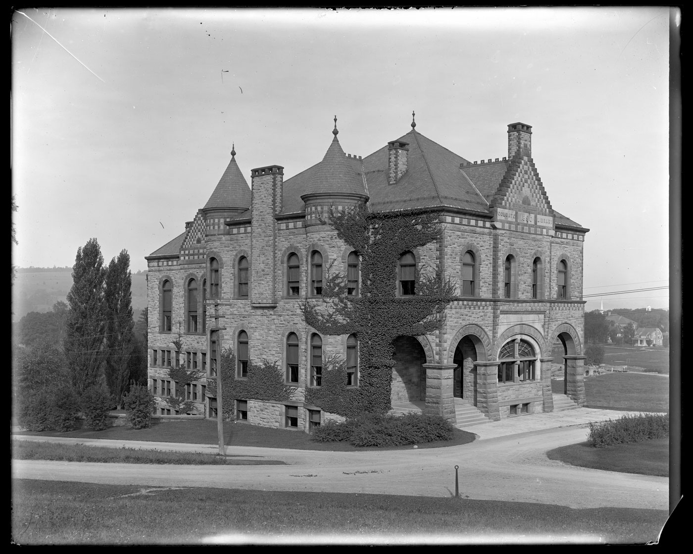 Archival image of an ivy-covered James B. Colgate Hall