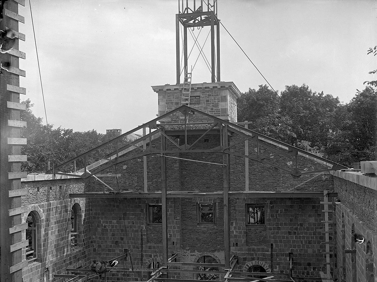 A look into Memorial Chapel as construction crews assemble the exterior stone, before a roof has been added